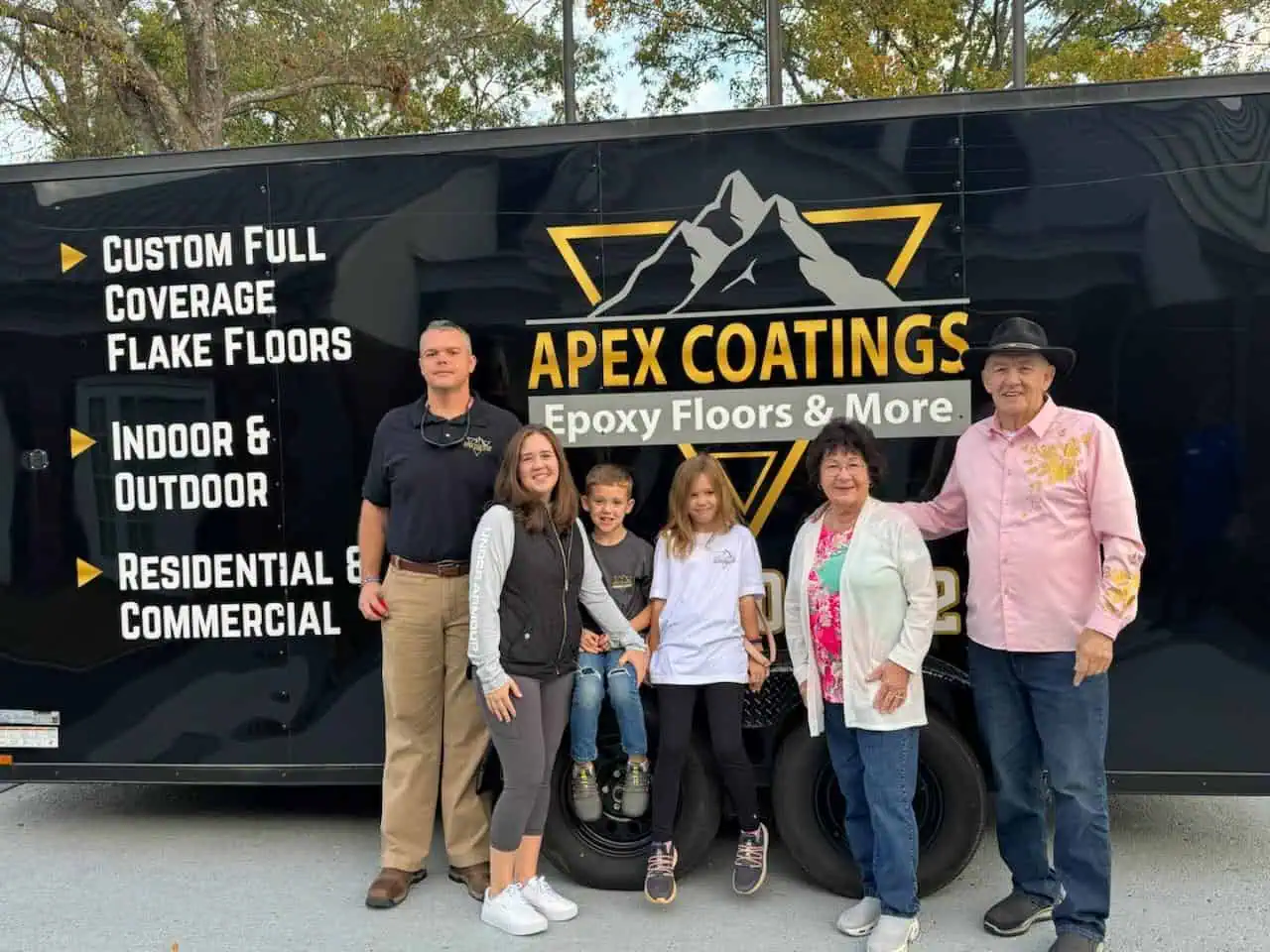 The Apex Coatings family with their branded company trailer.